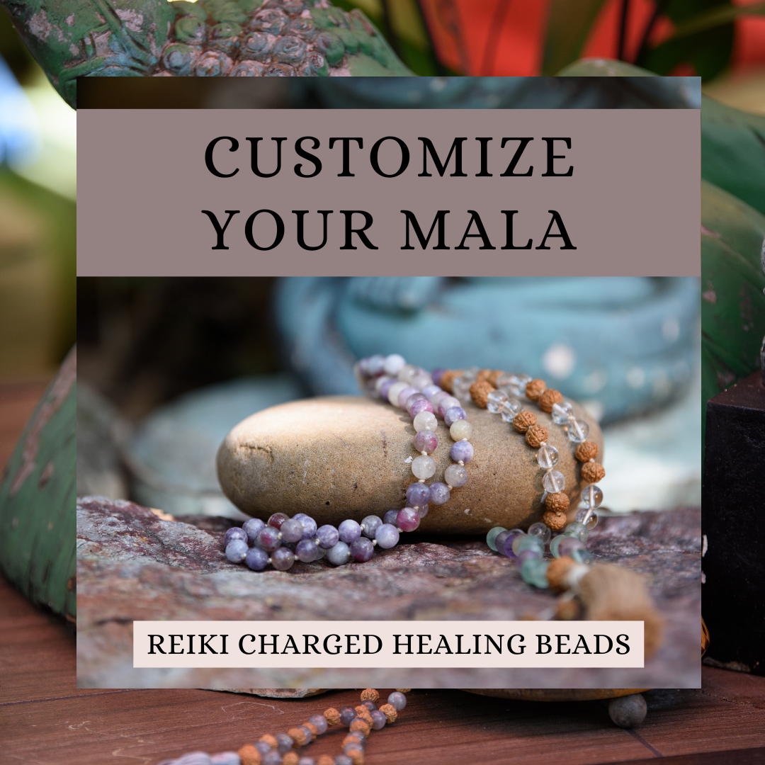 Reiki charged healing beads on a stone with text overlay.